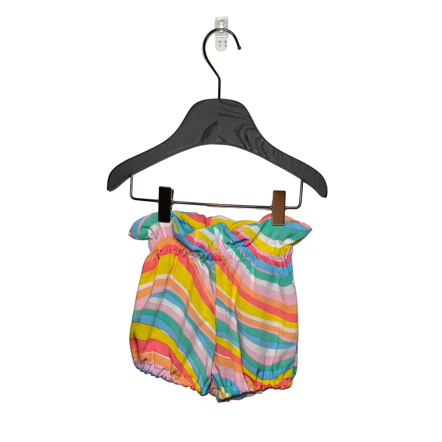A pair of multicolored striped baby bloomers hanging on a hanger against a white background.