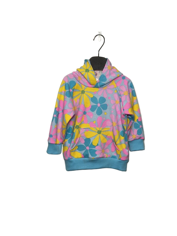 Colorful floral-patterned hoodie on a hanger against a plain background