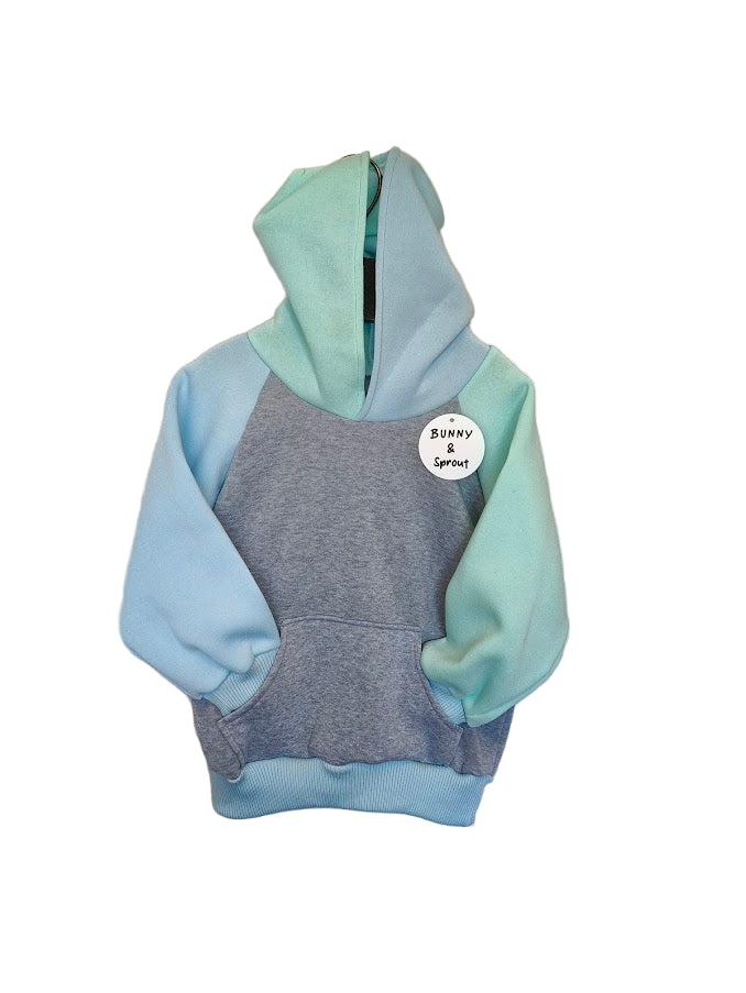 Multicolored hoodie with a label on a white background