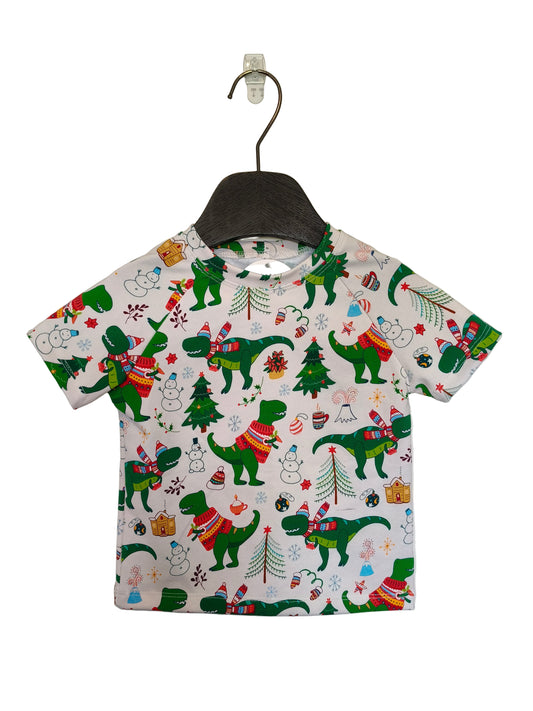 Children's t-shirt with Christmas-themed dinosaur print on a hanger against a plain background