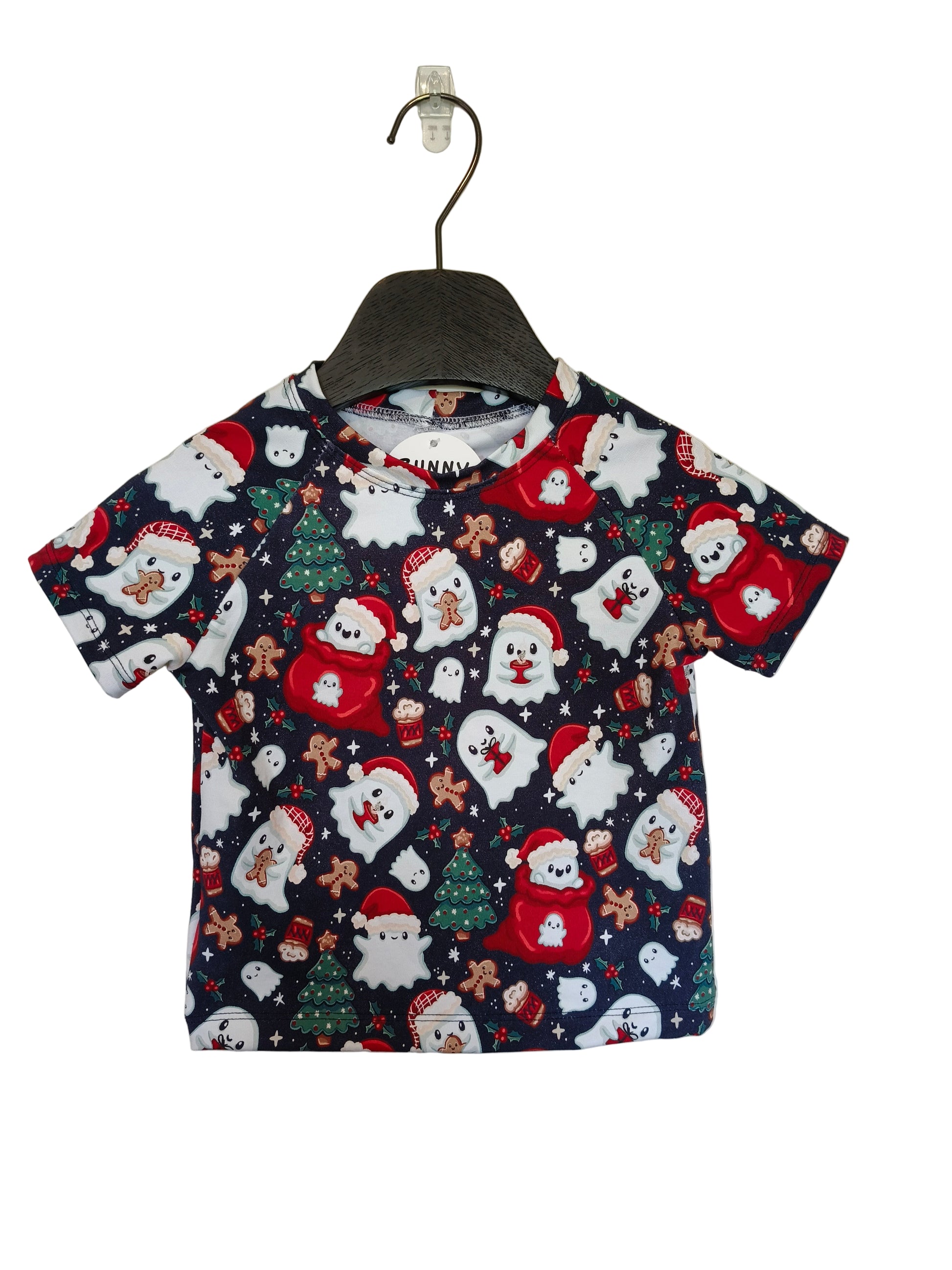 Children's t-shirt with Christmas-themed design on a hanger against a plain background