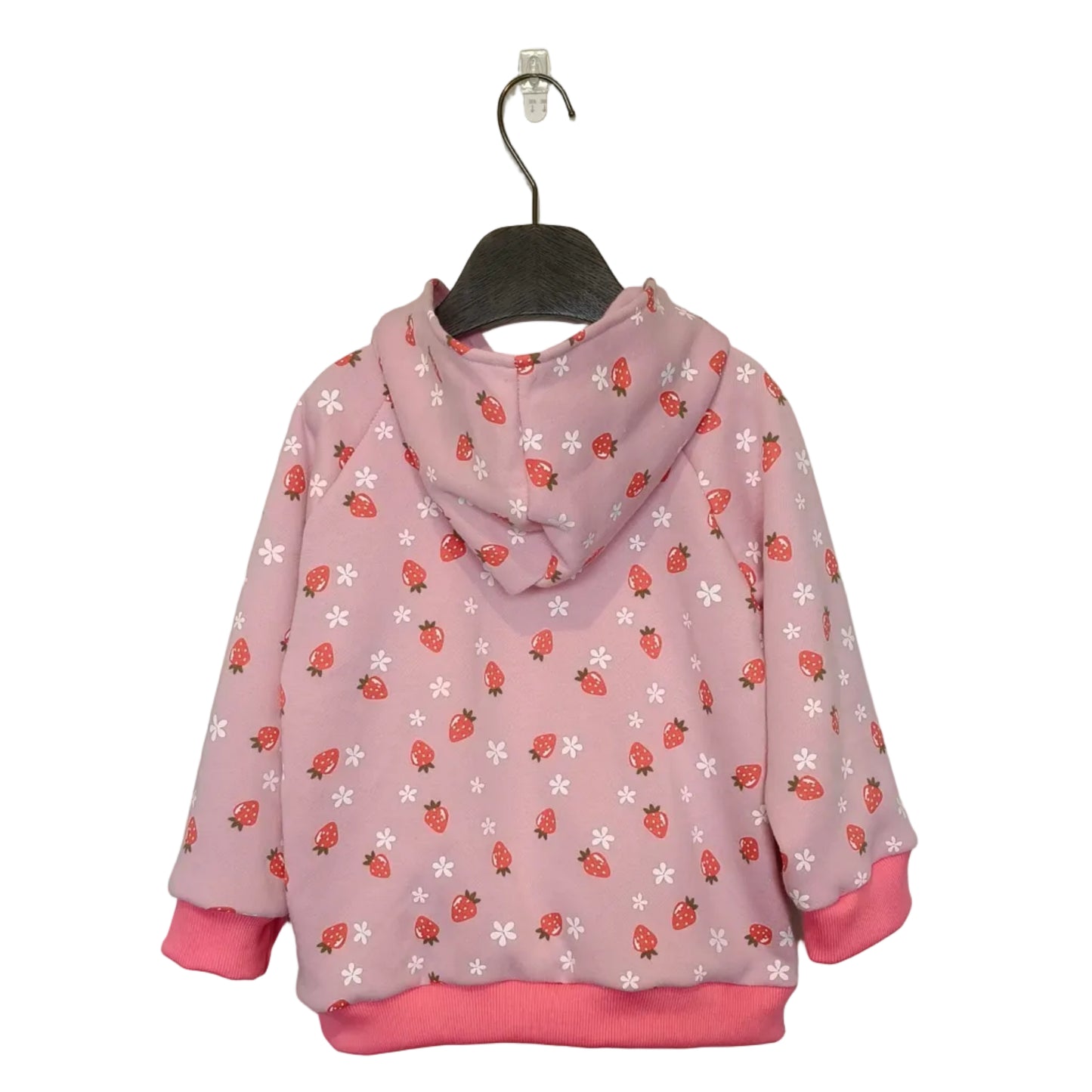 Pink hoodie with strawberry pattern on a hanger against a gray background
