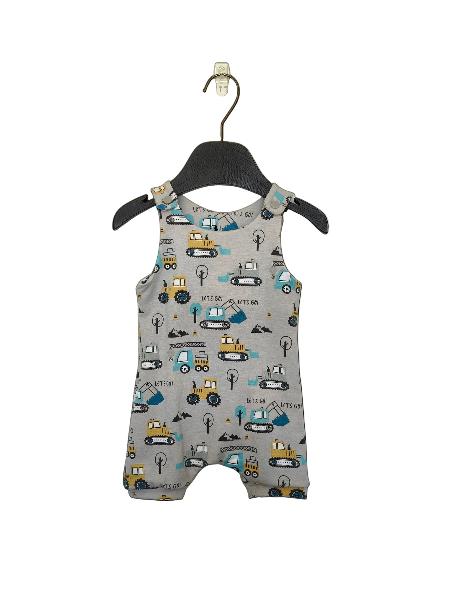 A short-sleeved romper for kids displayed on a hanger, featuring a multicolored print with car motifs.
